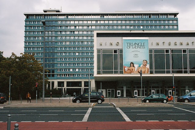 image of cinema building with movie advertising